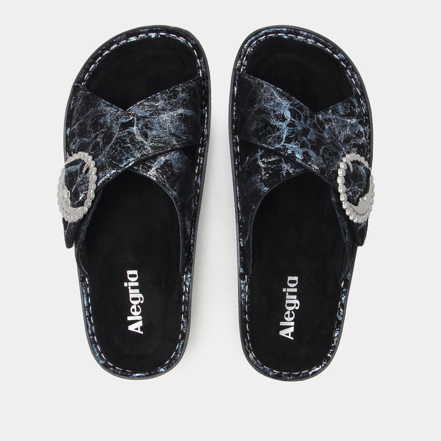 Pair of black and gray marbled sandals with 'Alegria' branding on a light gray background