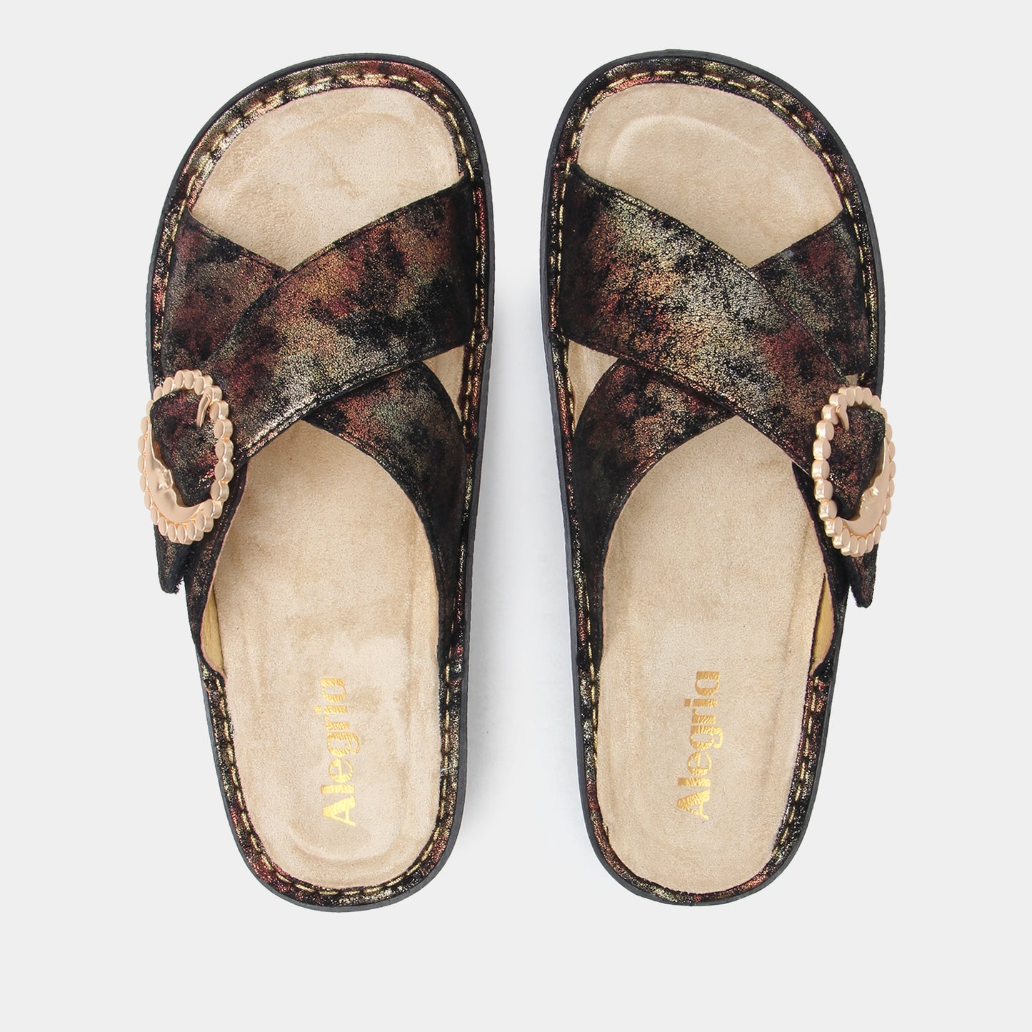 Pair of sandals with floral pattern on a white background